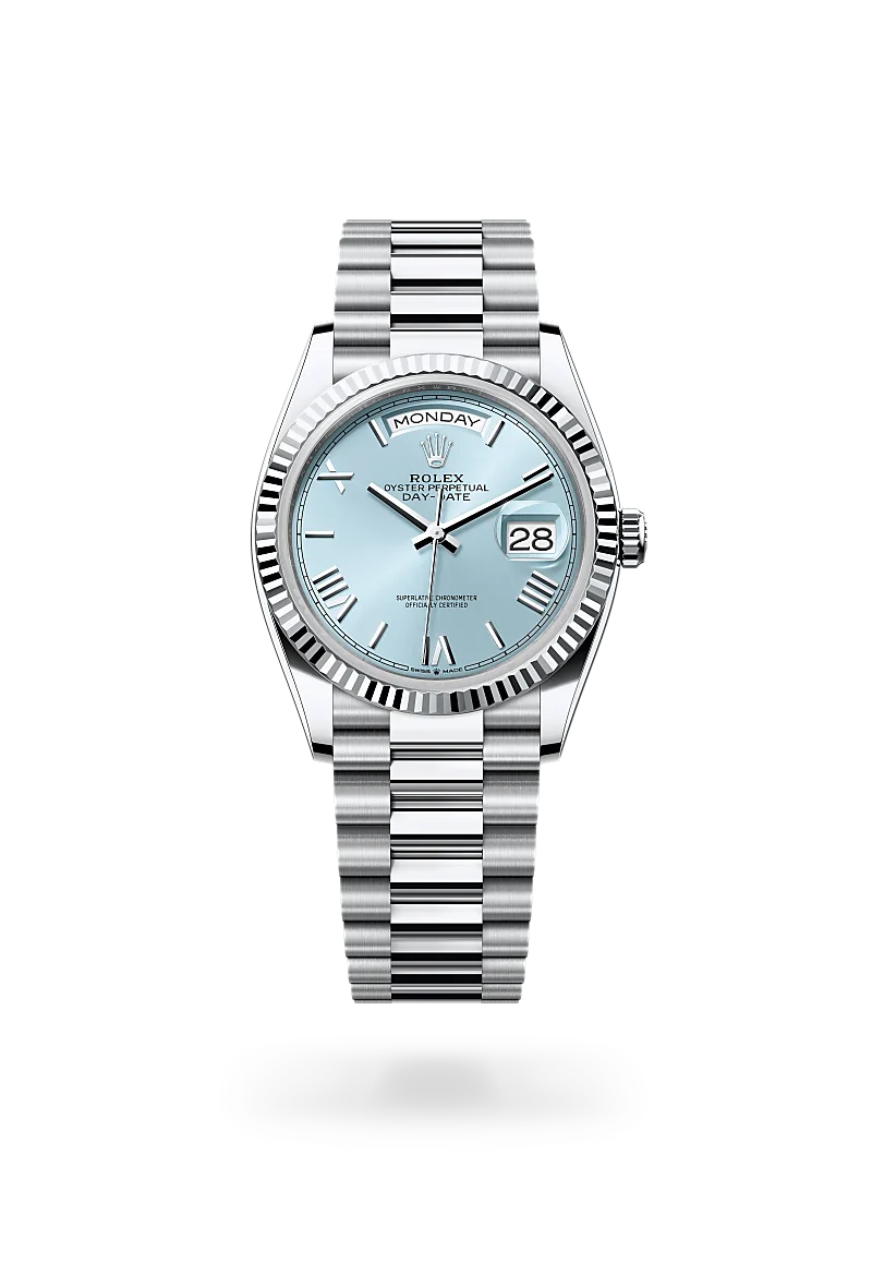 Rolex Day-Date 36 in Platinum with a Ice blue dial, Fluted bezel, President, semi-circular three-piece links bracelet.