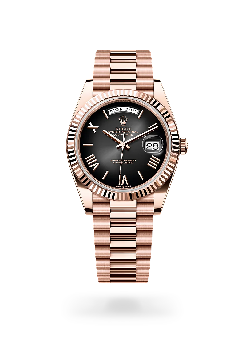 Rolex Day-Date 40 in 18 ct Everose gold with a Slate ombré dial, Fluted bezel, President, semi-circular three-piece links bracelet.