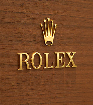 Rolex Gold Logo on Wood